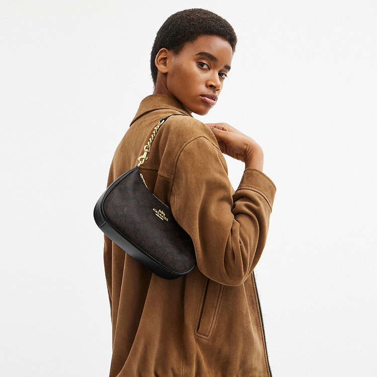 Teri Shoulder Bag
In Signature Canvas Techwosell